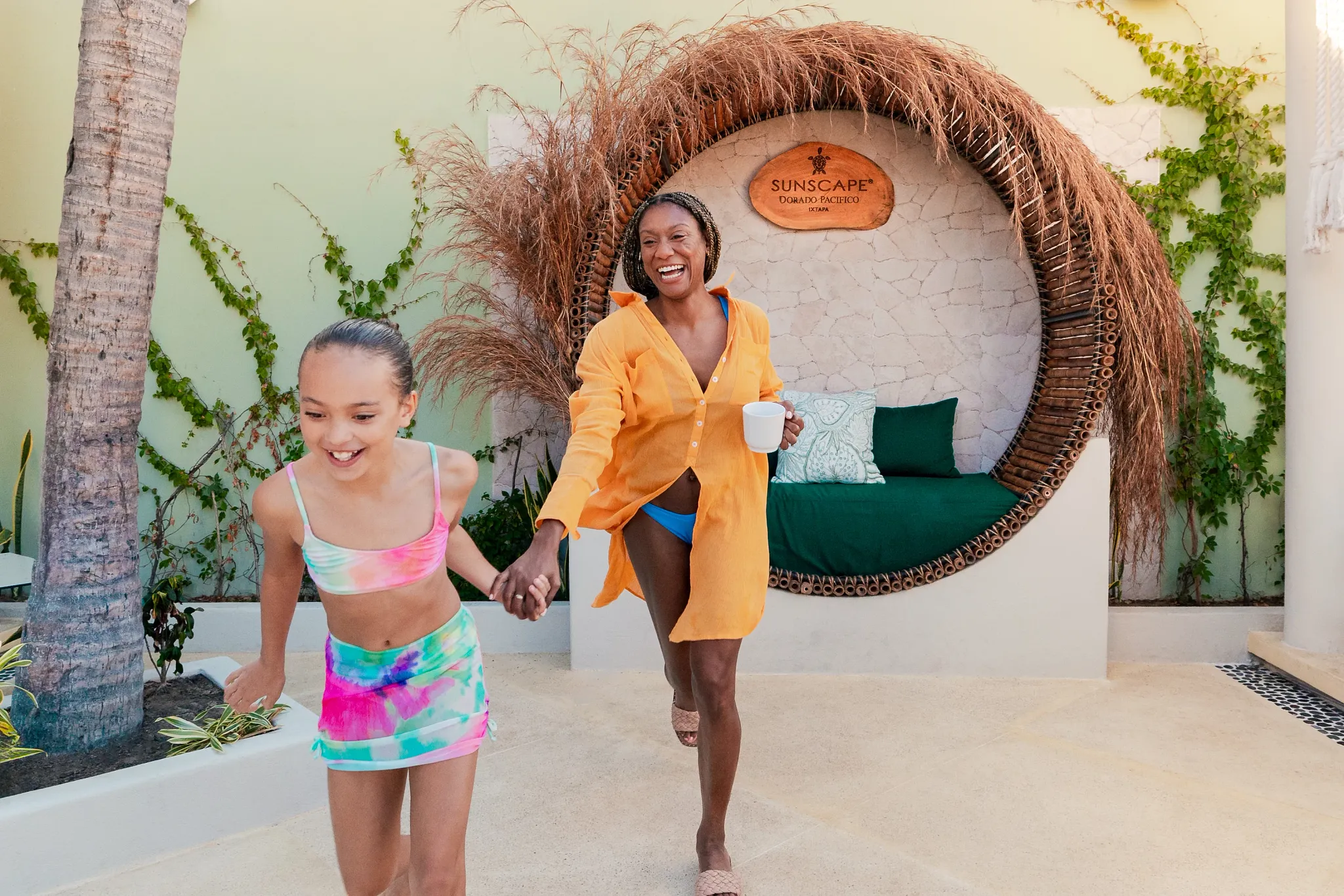 Mother and daughter walking near the Sun Club area at Sunscape Dorado Pacifico Ixtapa.