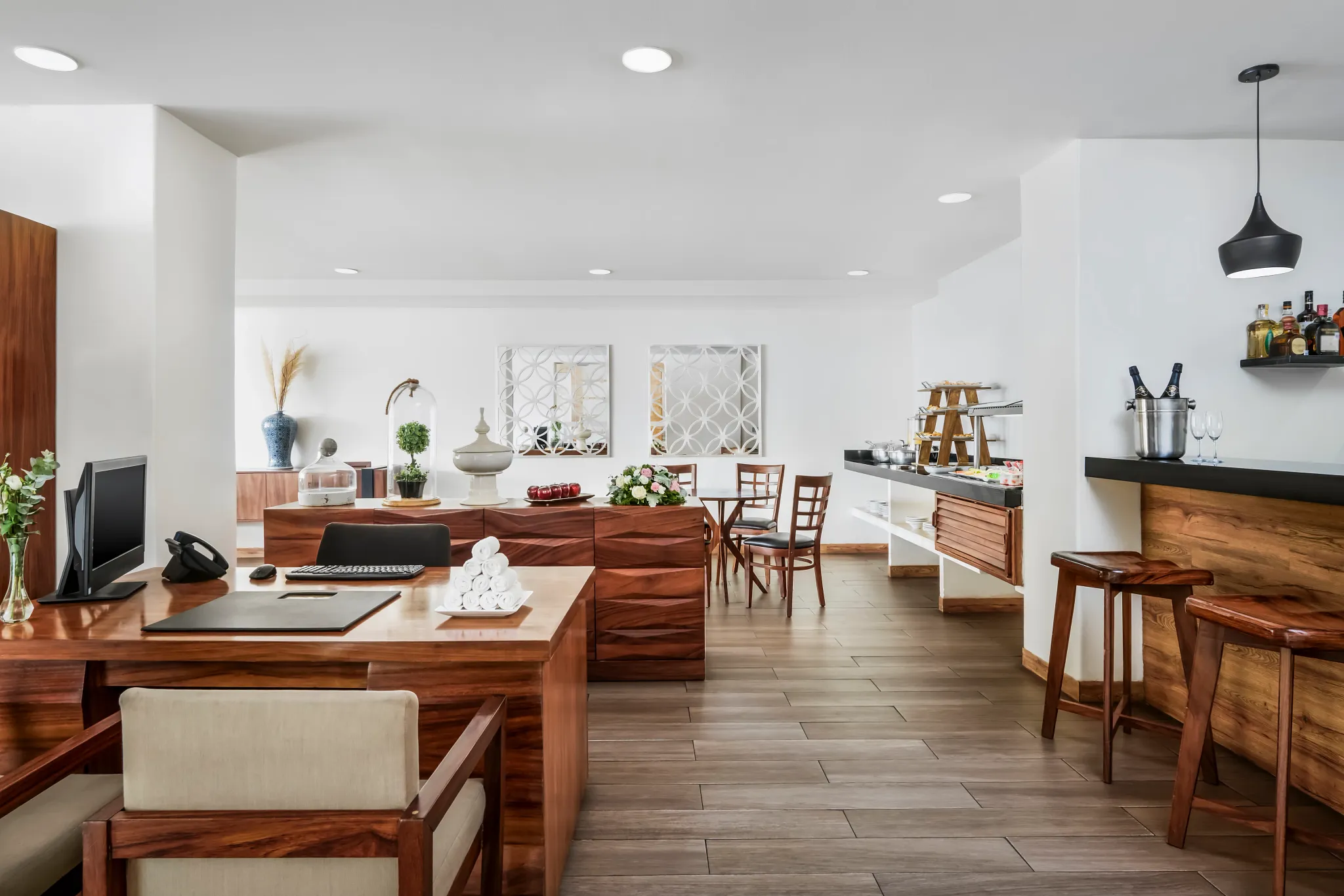 Modern Sun Club lounge with wooden furnishings and bar area at Sunscape Dorado Pacifico Ixtapa.