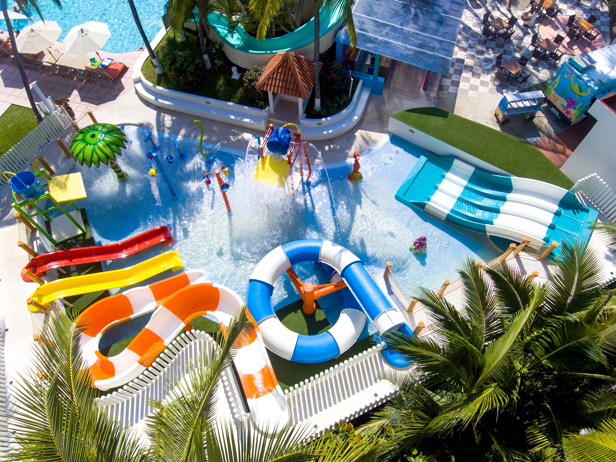 Aerial view of Sunny Splash Park with colorful water slides and splash features at Sunscape Dorado Pacifico Ixtapa.