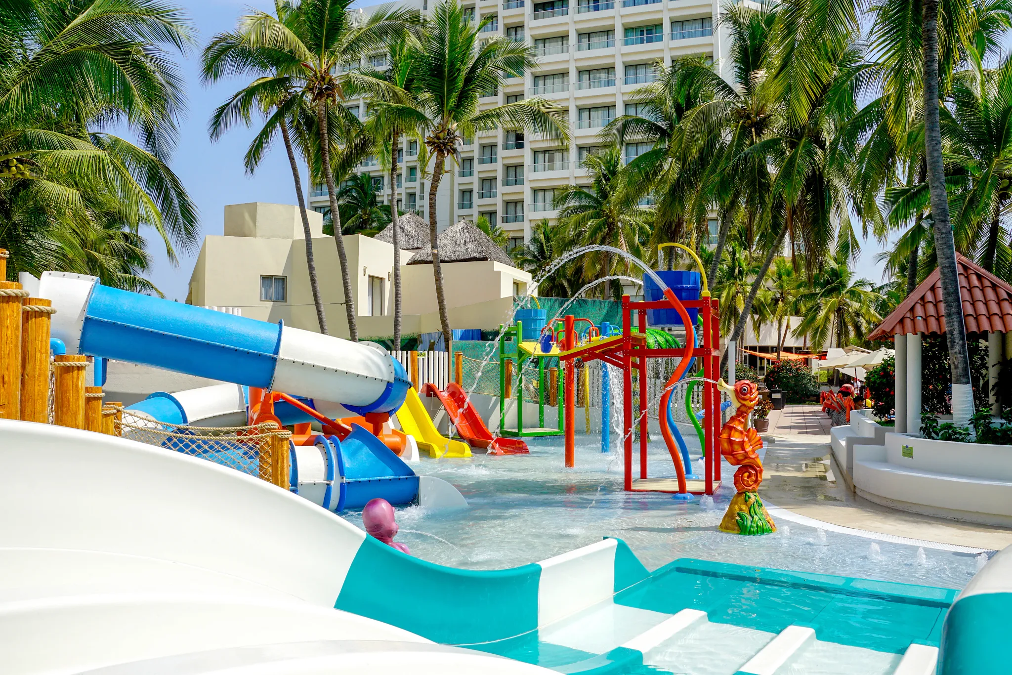 Colorful splash park with water slides and play features at Sunscape Dorado Pacifico Ixtapa.